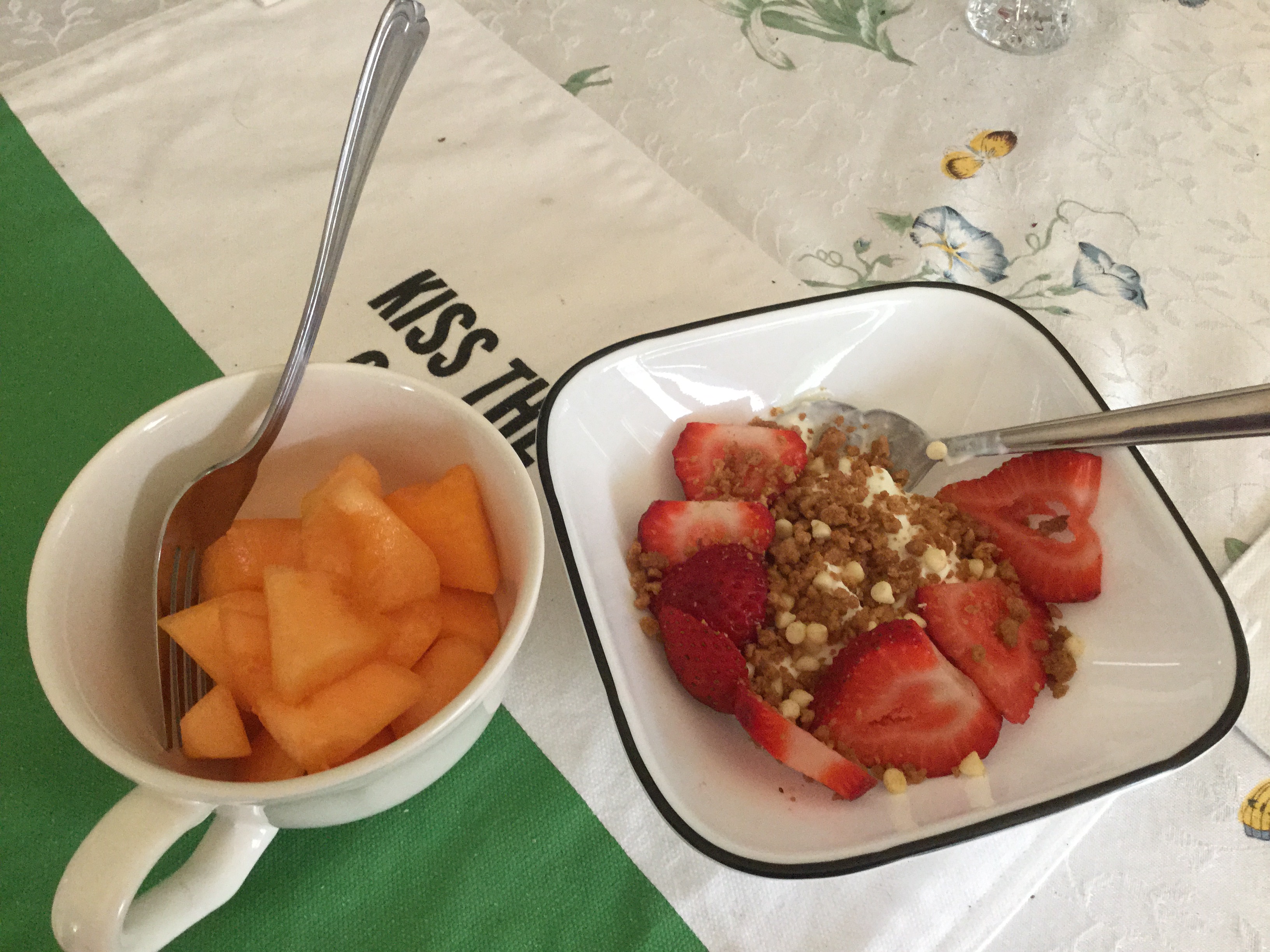 Breakfast for my hubs! yogurt with strawberries and bowl of cantaloupe!